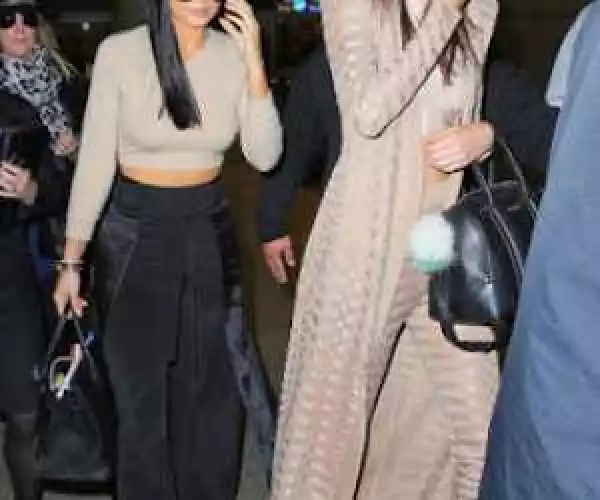 Photos: Kylie and Kendall Jenner show off their toned midriffs in matching beige crop tops